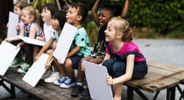 Young children doing an activity on a field trip