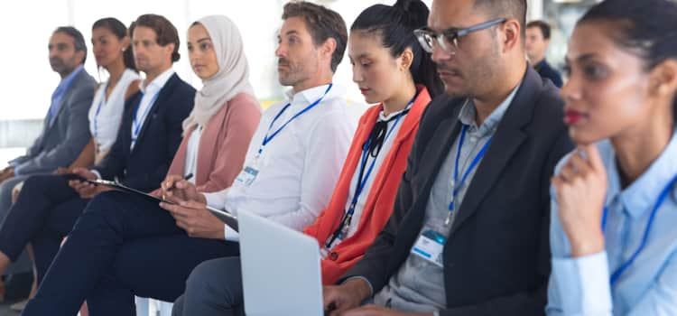 A panel of people at a business conference